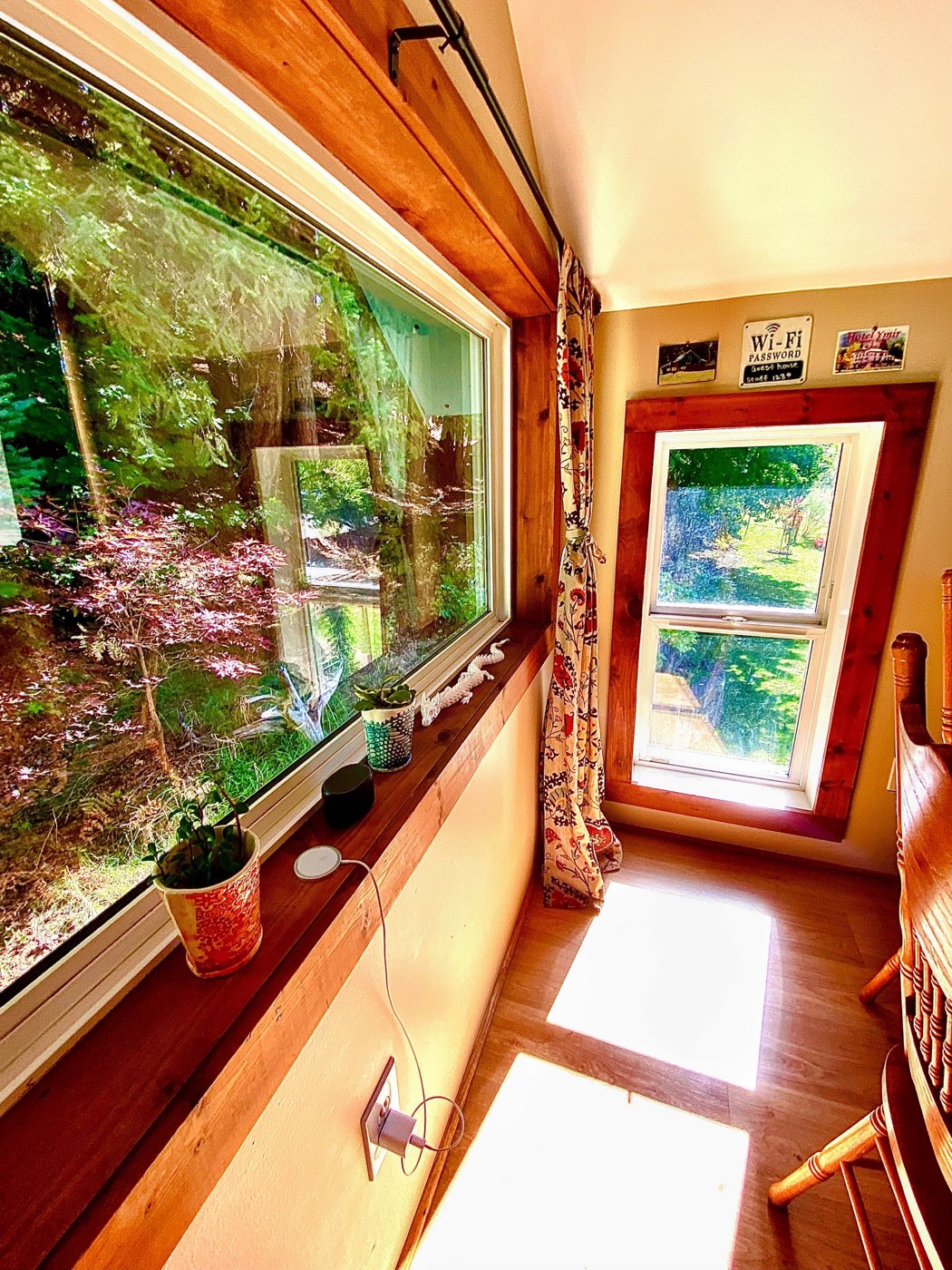 The dining nook window looking out into the maples and garden
