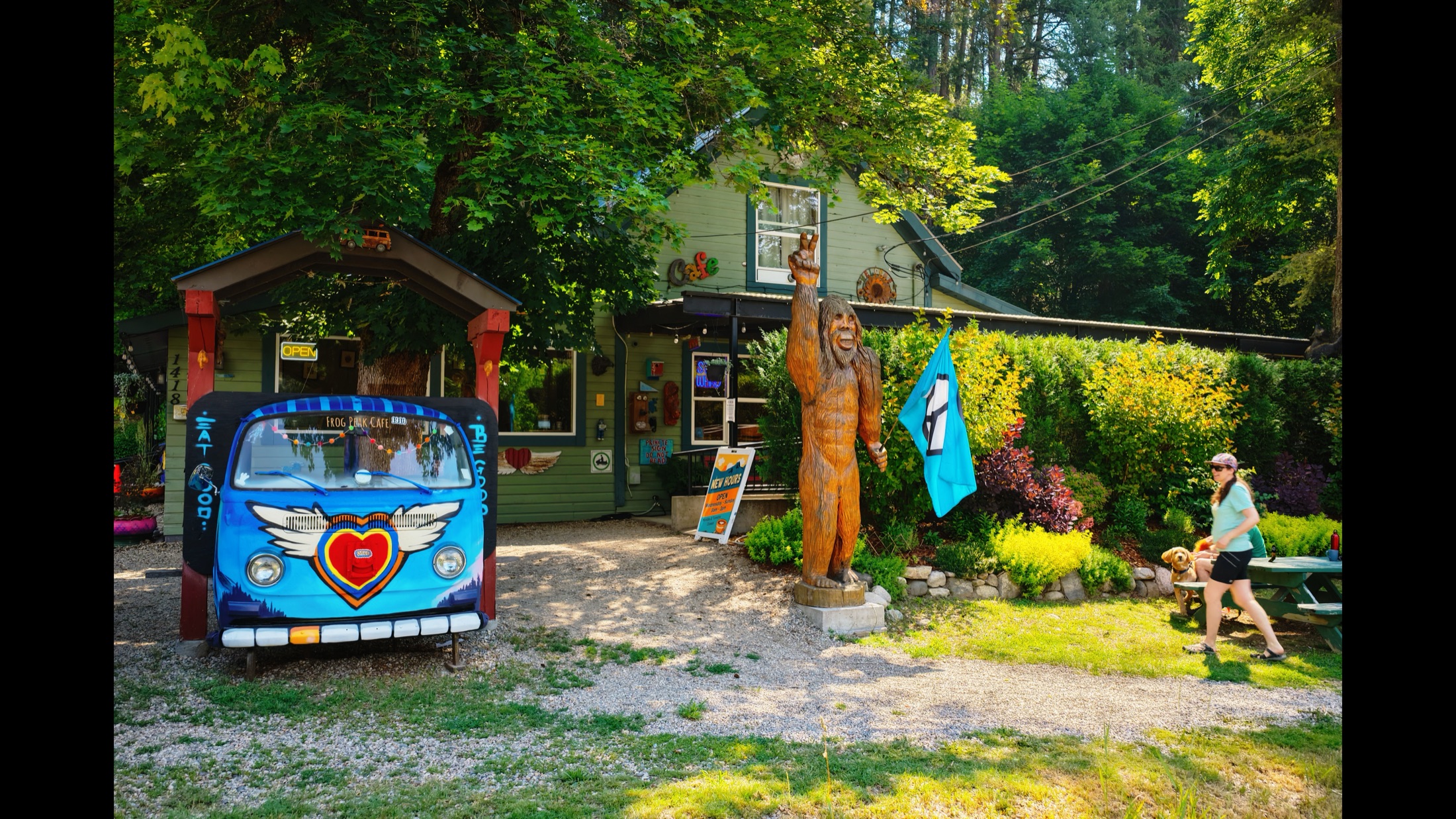 The Frog Peak Café flower-power van and Sasquatch carving out front